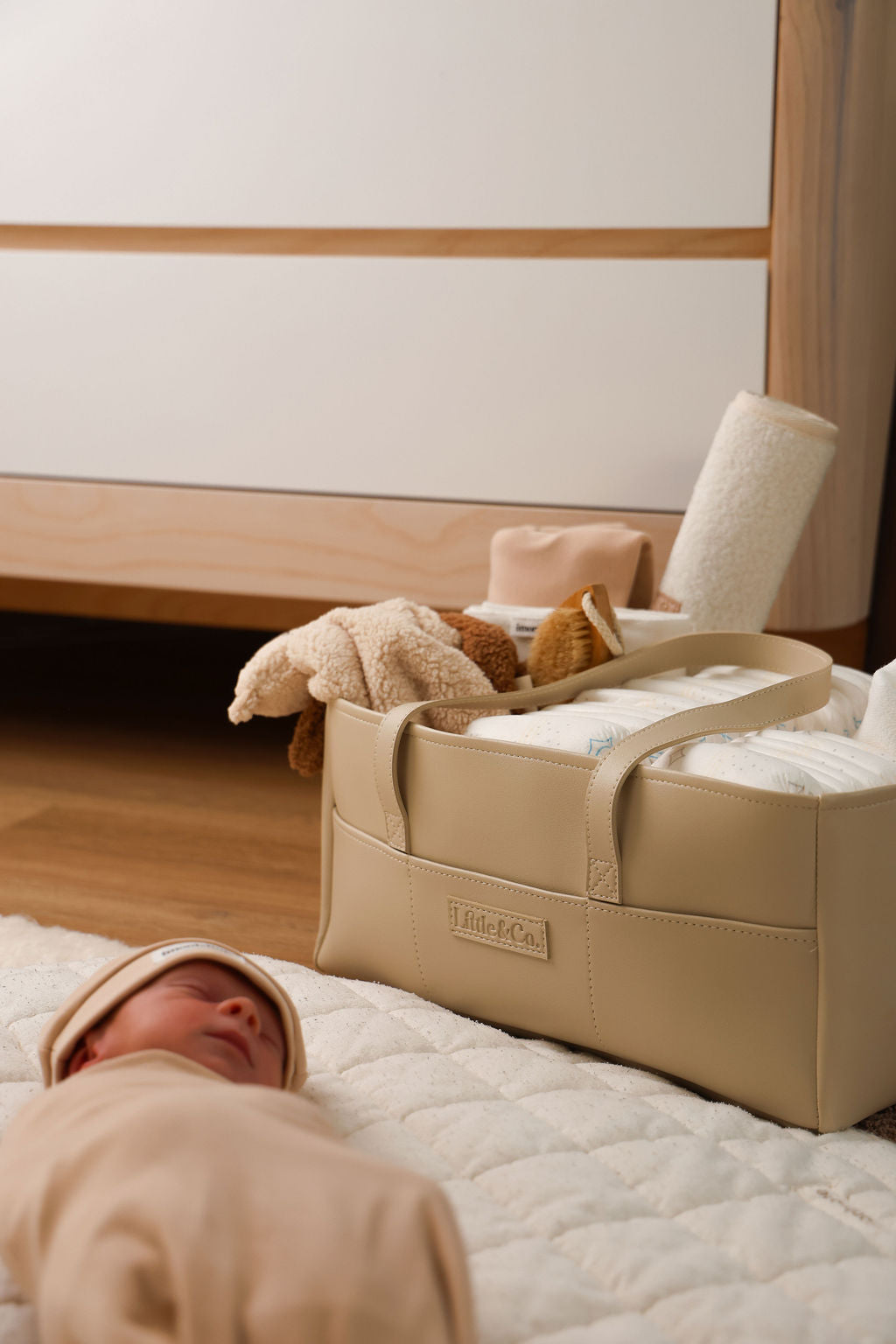 A beige diaper bag