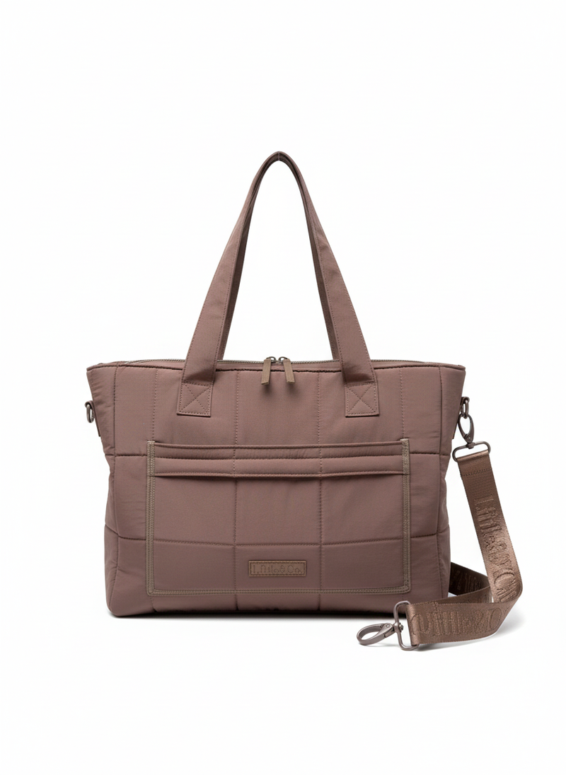 Brown quilted handbag with a shoulder strap on a white background