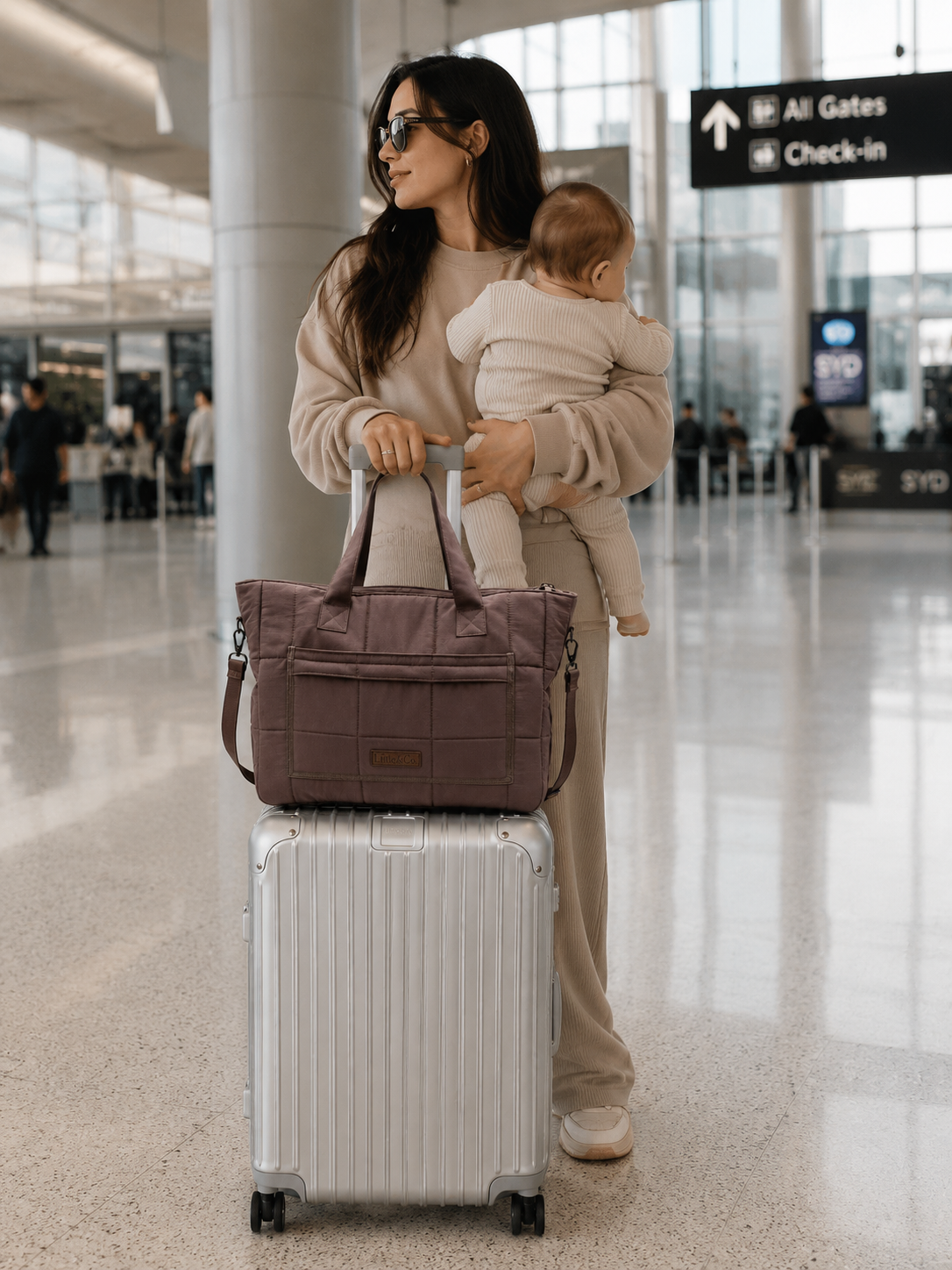 Mother at airport with bag