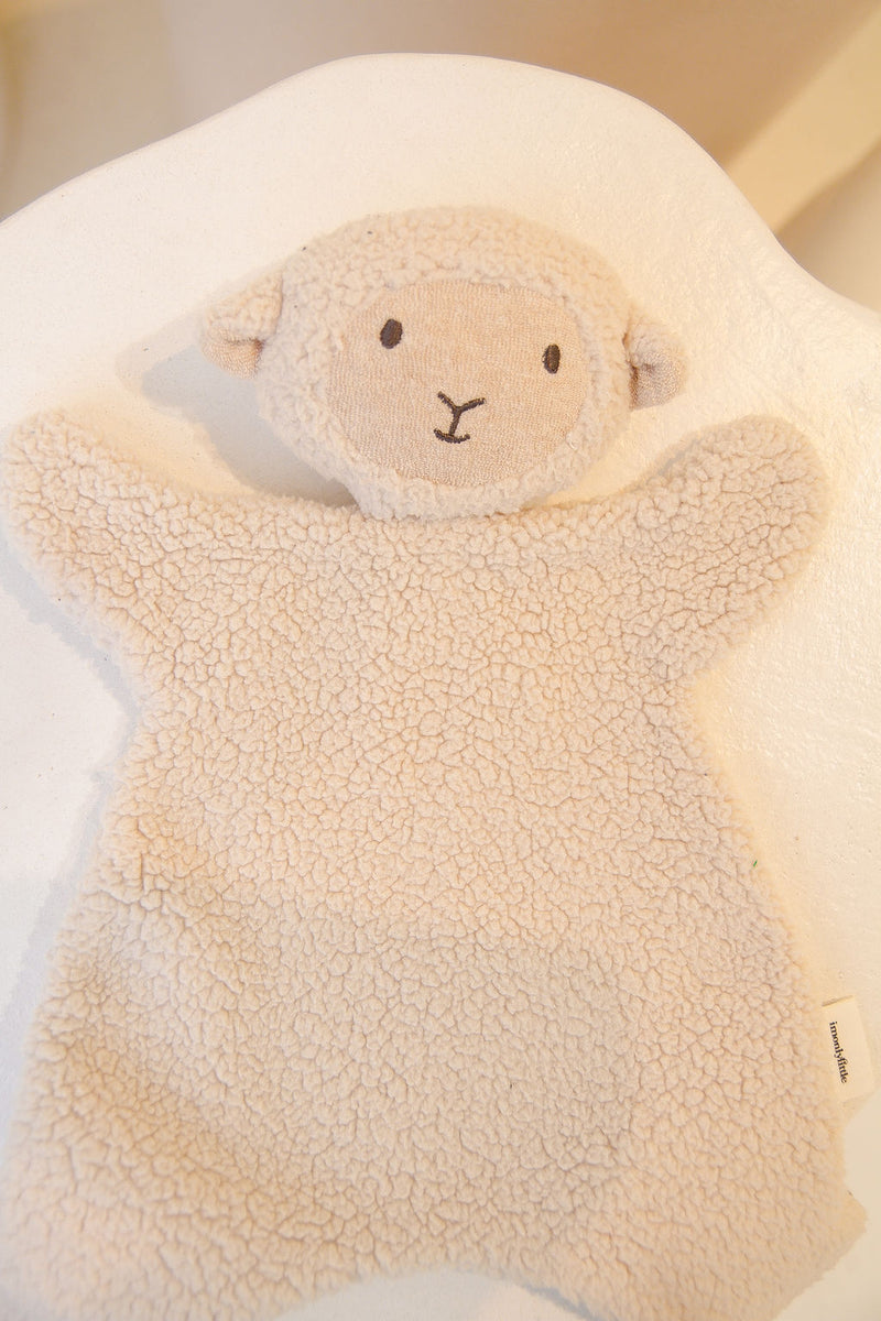 Lamb cuddly laying on chair 
